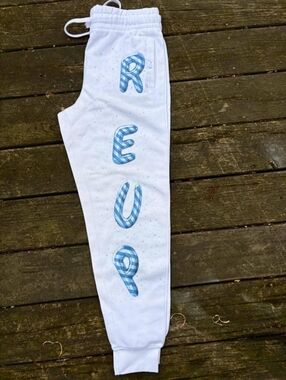 White Sweatpants with Blue Lettering